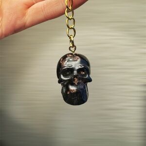 Black small skull keychain with gold foil inside, customizable to be any color